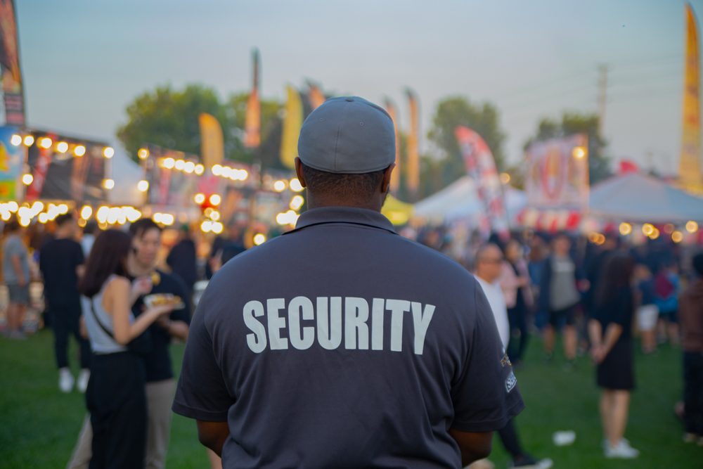 Security,Guard,Controlling,The,Traffic,And,Parking,At,Asian,Festival