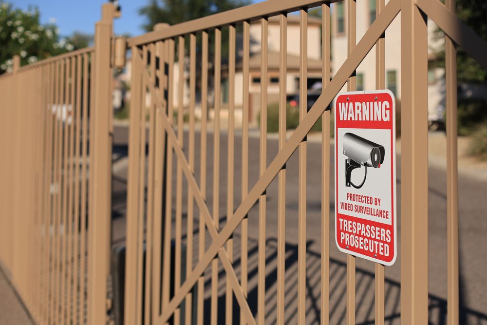 Trespassers,Prosecuted,Warning,Sign,Placed,On,The,Bars,Of,Metal