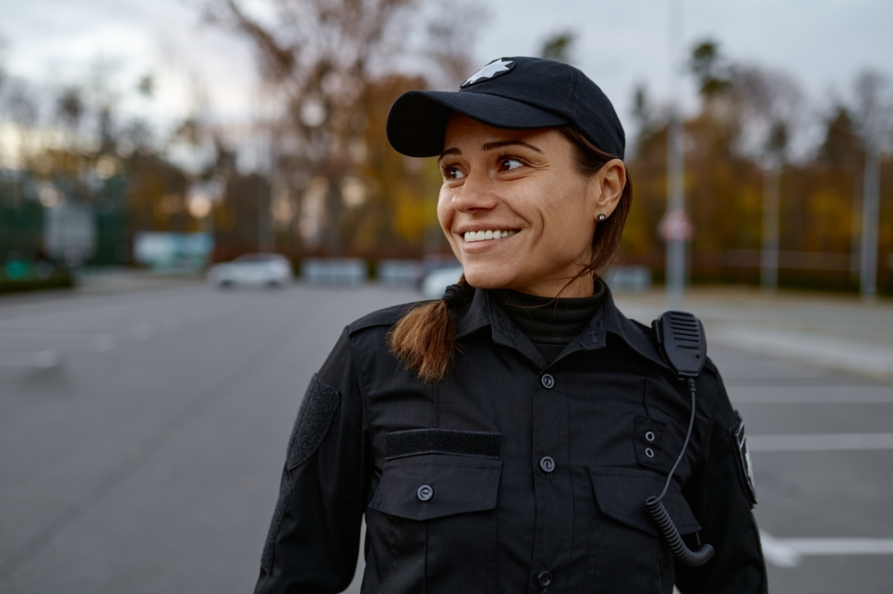Portrait,of,smiling,police,woman,on,street