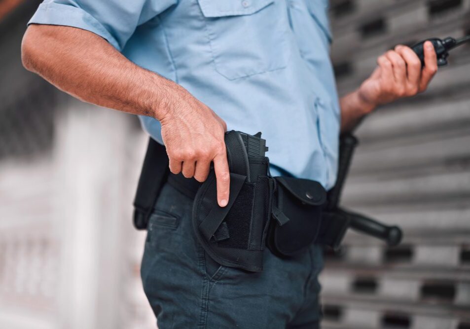 Closeup,,Law,Or,Police,Officer,With,A,Gun,,Safety,Or
